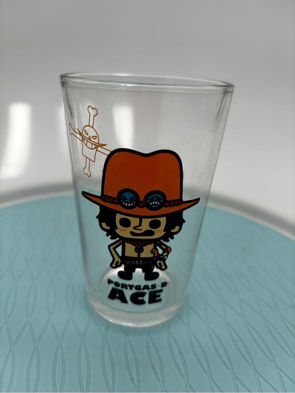 Portgas D. Ace in the signature "chibi" art style of PansonWorks Juice Glass